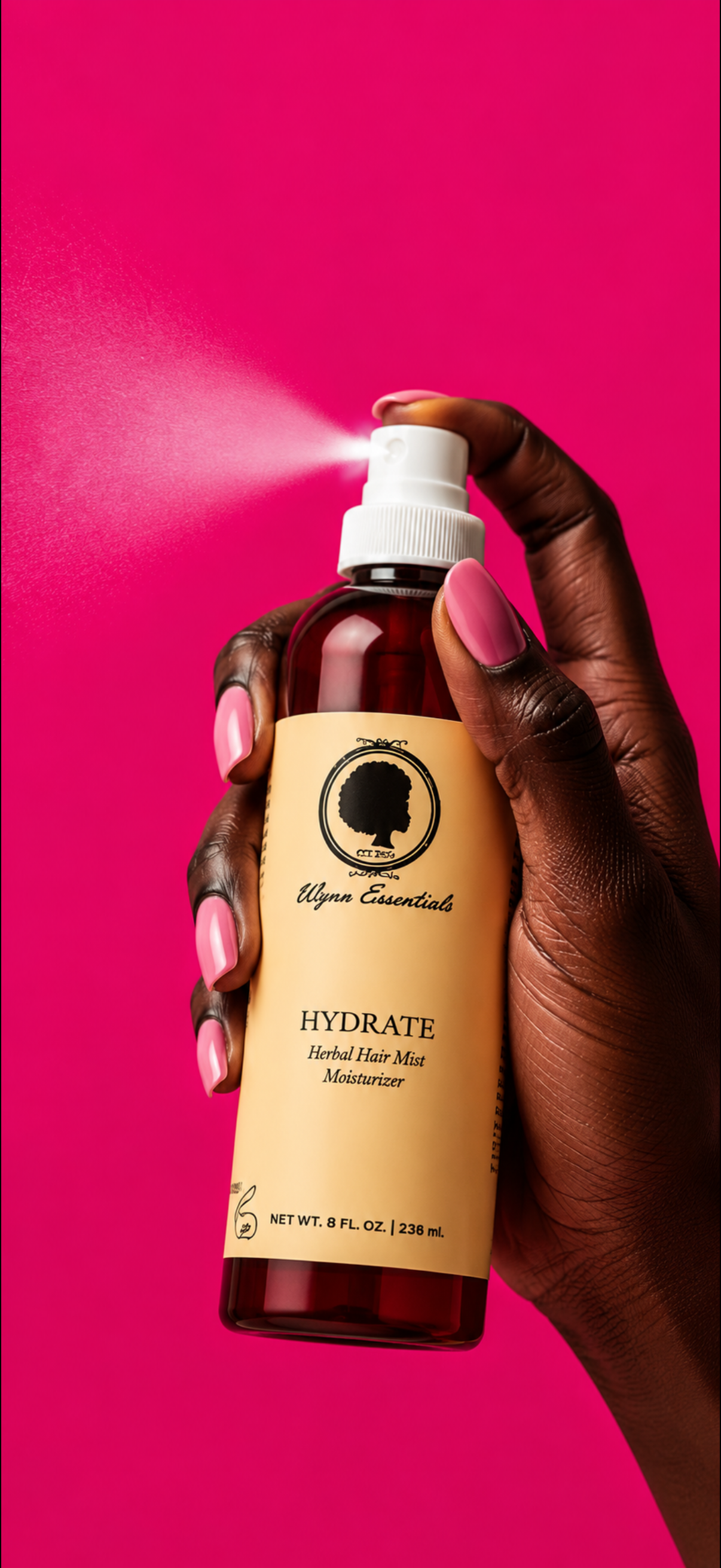 Hydrate Herbal Hair Mist spraying against a vivid pink background