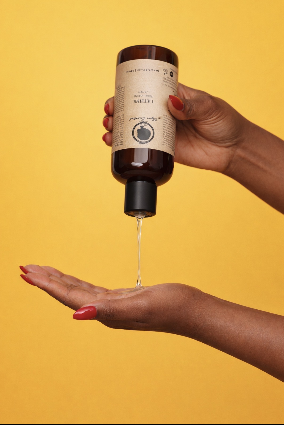 Lathyr Gentle Cleansing Shampoo being poured into a hand